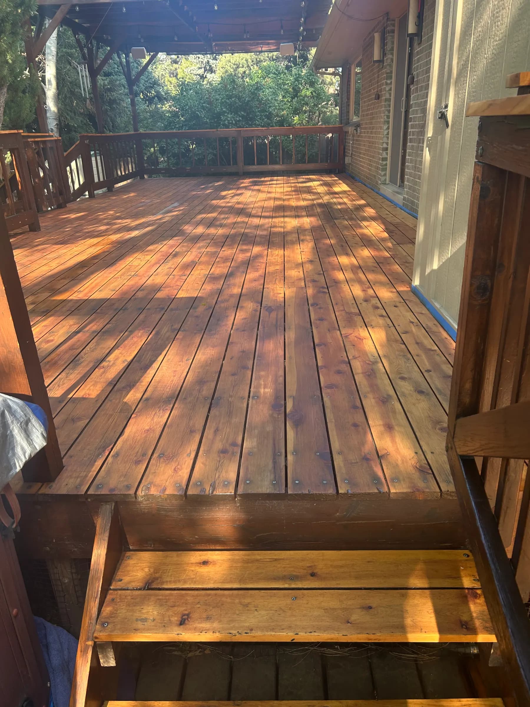Freshly stained cedar deck with new steps